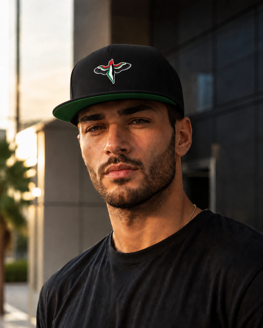Model wearing FREEDOM WINGS Palestine flat bill cap from Warrior Ink Apparel