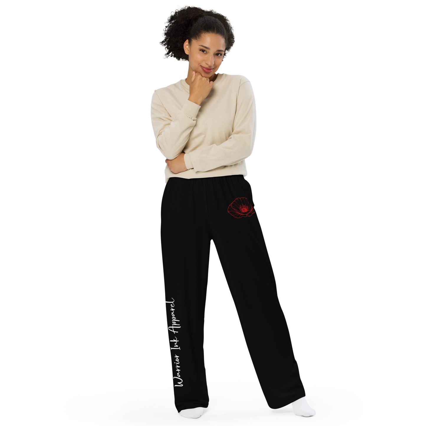 Model wearing RED POPPY OF PALESTINE wide-leg pants by Warrior Ink Apparel