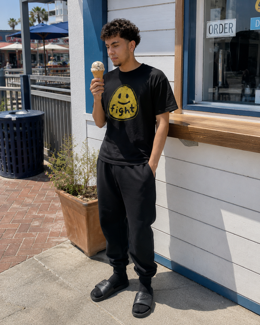 Model wearing FIGHT FOR HUMANITY organic oversized tee by Warrior Ink Apparel