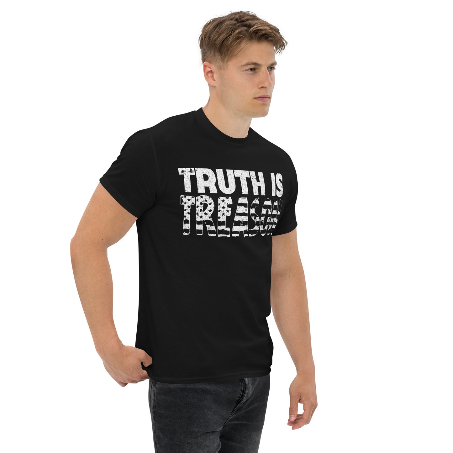Male model wearing a Black t-shirt with 'TRUTH IS TREASON' printed in bold distressed white lettering over a faded American flag; Warrior Ink logo on upper back.