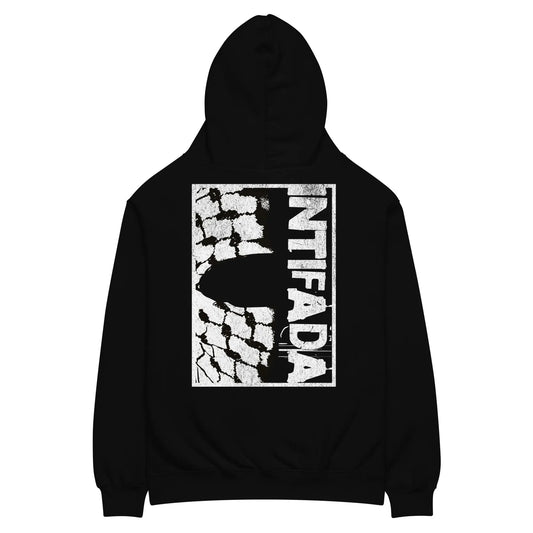 Back view of the black oversized hoodie featuring a keffiyeh-patterned "INTIFADA" design in bold white typography.
Close-up of the keffiyeh texture incorporated into the typography, highlighting the symbolic connection to Palestinian heritage.
Side angle of the oversized hoodie, showing its relaxed fit, ribbed cuffs, and structured silhouette.