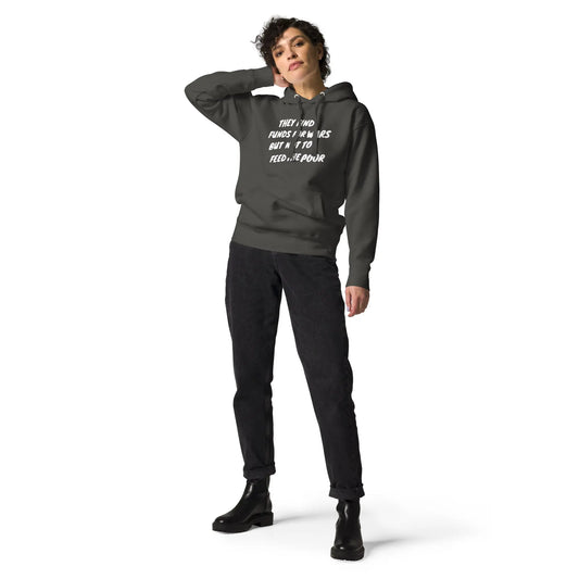 Model wearing the Feed The Poor Hoodie – statement streetwear with bold text design, front pouch pocket, and a relaxed fit.