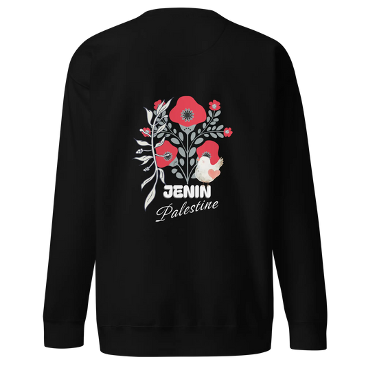 Back view of the Jenin Premium Sweatshirt, featuring a red poppy floral design, an olive branch, and a white dove with a heart, representing Palestinian resilience and cultural identity.
A Palestinian sweatshirt from the Watermelon Edition line, blending streetwear and heritage.
A close-up of the Jenin emblem design, highlighting intricate Palestinian symbols and craftsmanship.