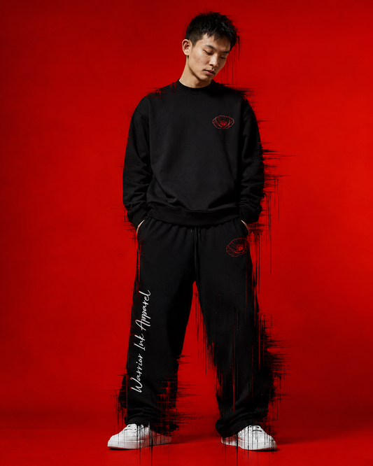 Model wearing RED POPPY OF PALESTINE crewneck sweatshirt and wide joggers by Warrior Ink Apparel