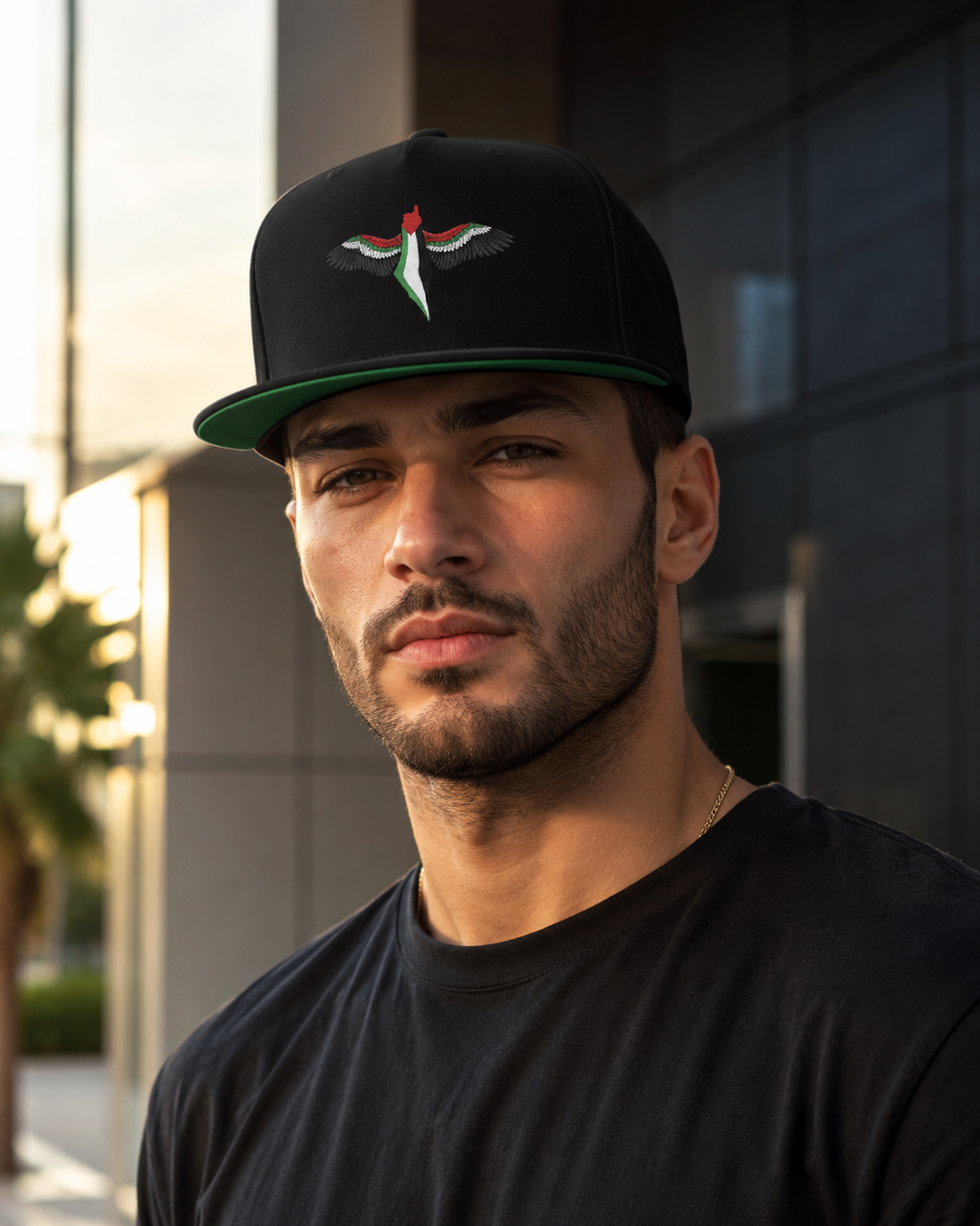 Model wearing FREEDOM WINGS Palestine flat bill cap from Warrior Ink Apparel