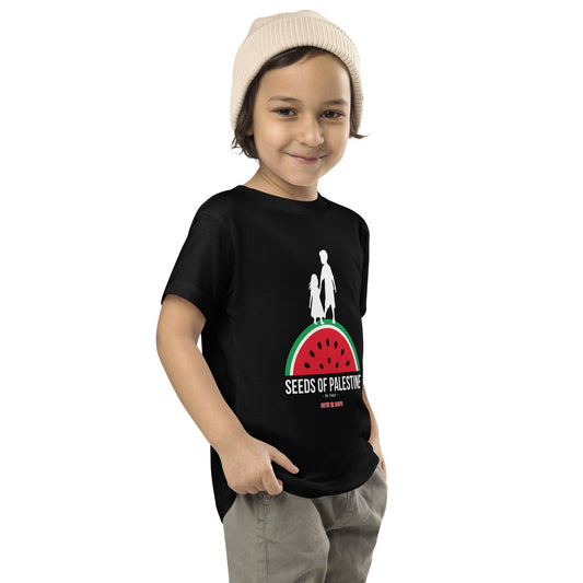 Toddler wearing SEEDS OF PALESTINE graphic tee from the Mo Hamz Collection