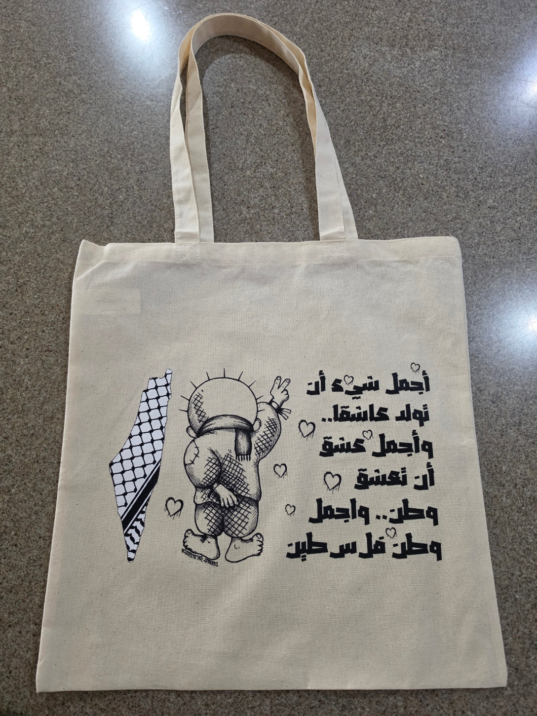 Palestine cotton tote bag featuring Handala character with Arabic text and keffiyeh map design