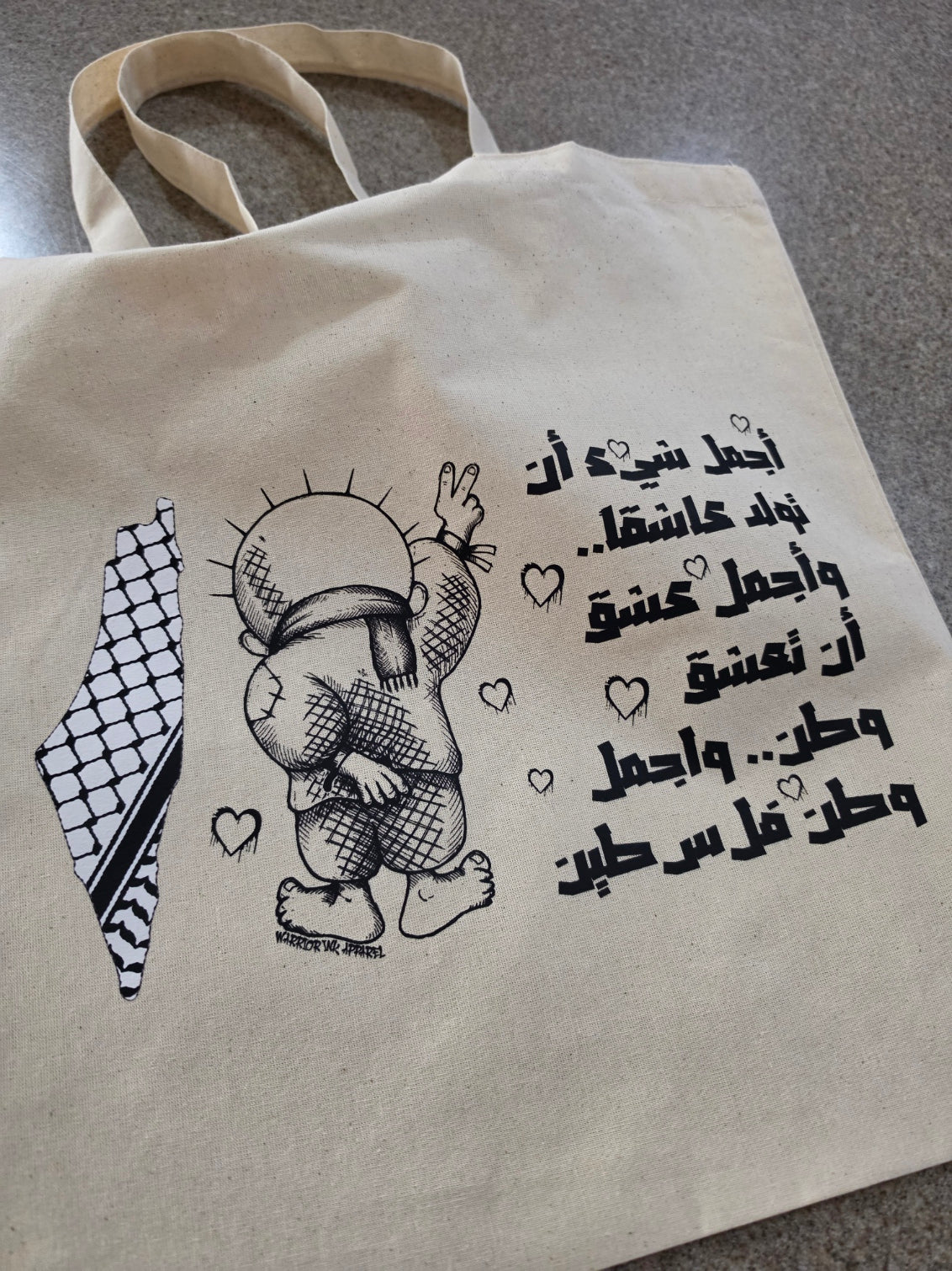 Palestine cotton tote bag featuring Handala character with Arabic text and keffiyeh map design