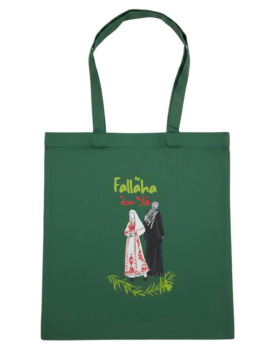Falaha Palestine cotton tote bag with Palestinian farmer illustration and Arabic text representing heritage and resilience by Warrior Ink Apparel
