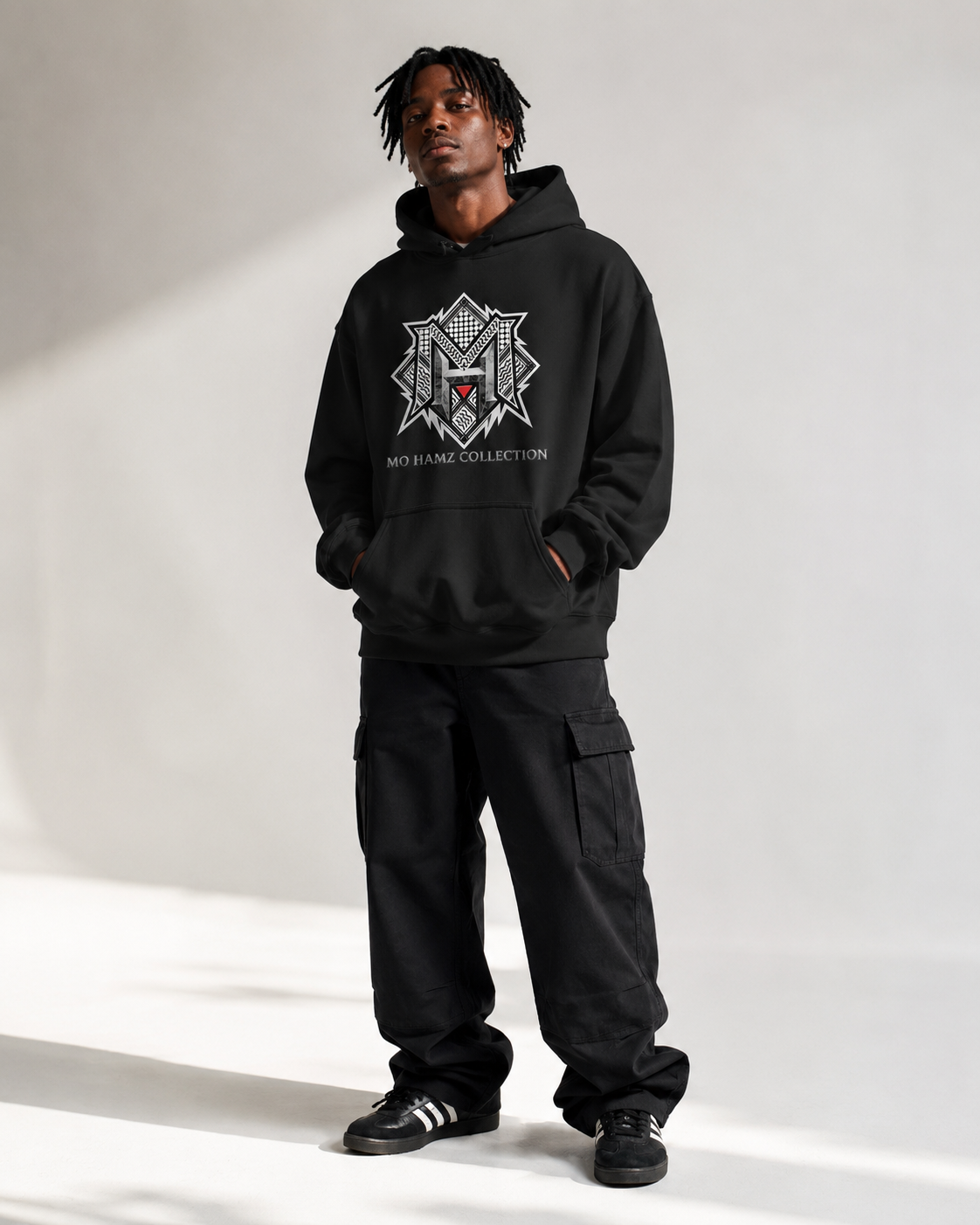 Model wearing MO HAMZ CREST Palestine hoodie from Warrior Ink Apparel