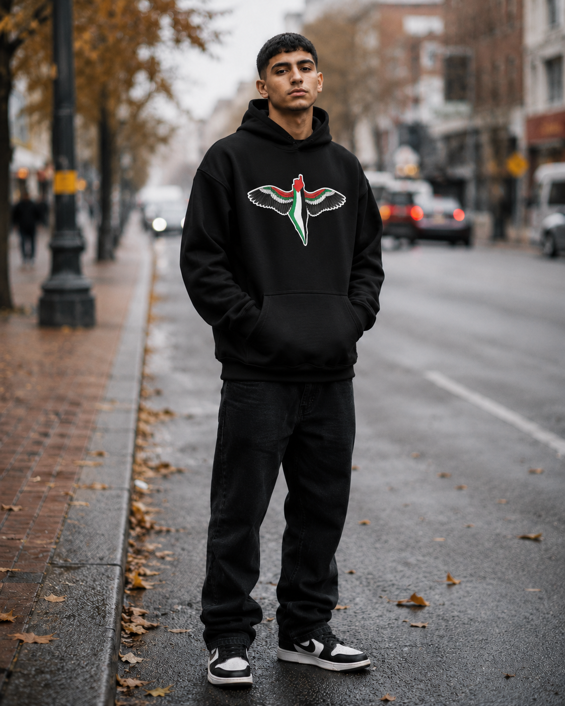 Model wearing FREEDOM WINGS Palestine hoodie from Warrior Ink Apparel