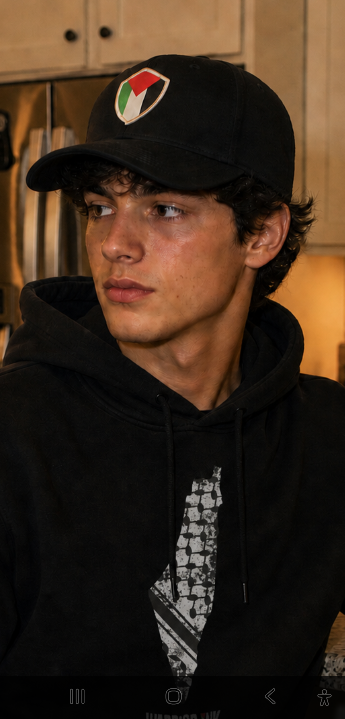 Palestine hat black cap with Palestine shield patch worn by model Warrior Ink Apparel