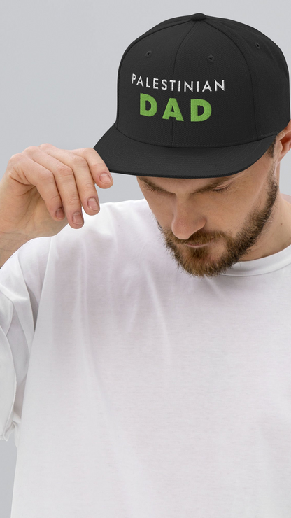 Model wearing PALESTINIAN DAD Palestine snapback cap by Warrior Ink Apparel