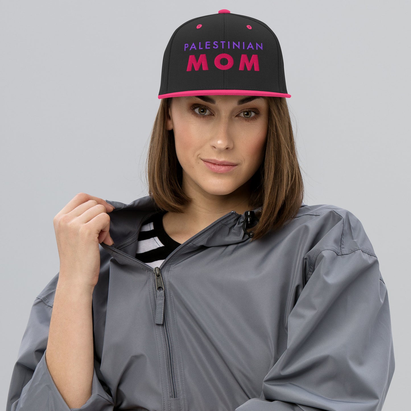 Model wearing PALESTINIAN MOM Palestine snapback cap by Warrior Ink Apparel