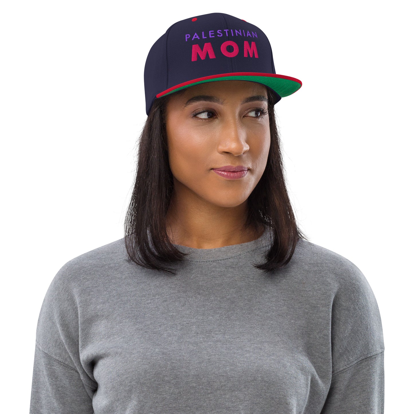 Model wearing PALESTINIAN MOM Palestine snapback cap by Warrior Ink Apparel