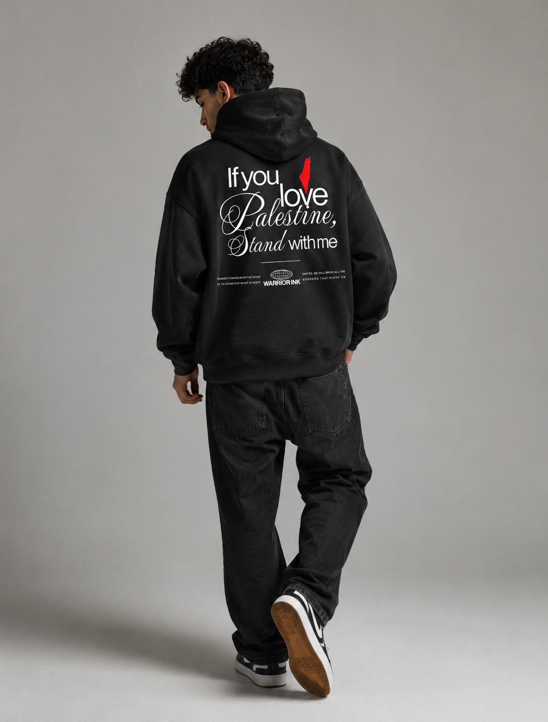 Model wearing STAND WITH PALESTINE organic hoodie by Warrior Ink Apparel