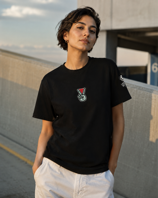 Model wearing NO PEACE UNTIL FREEDOM Palestine graphic tee from the Mo Hamz Collection