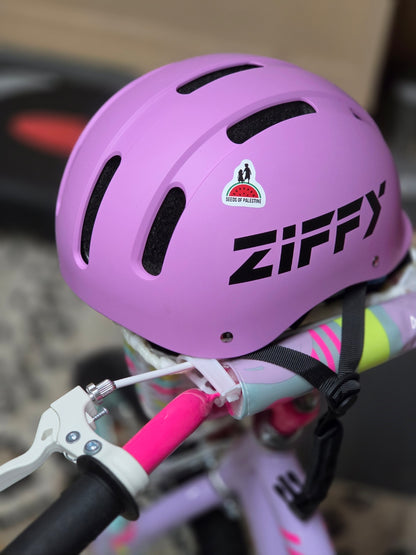 Seeds of Palestine sticker applied to pink bicycle helmet