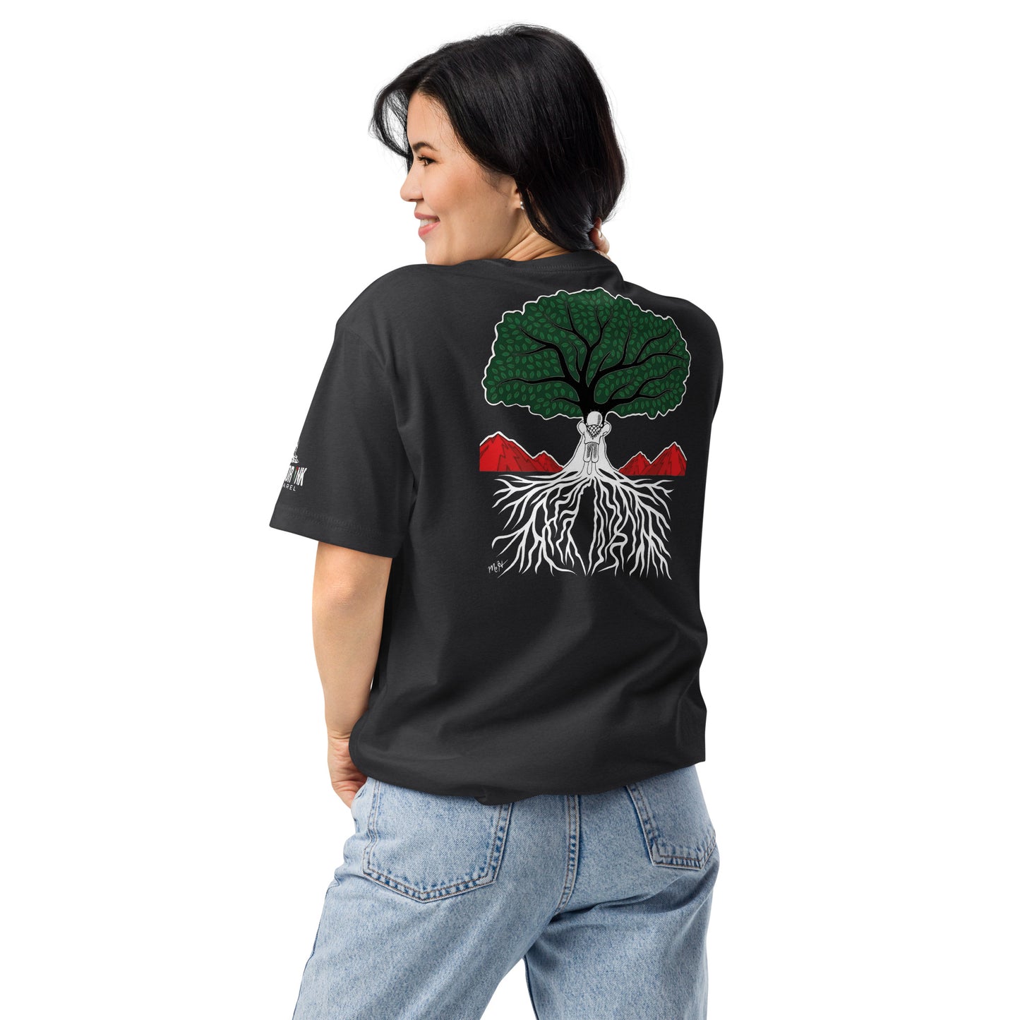 Model wearing EMBRACE YOUR ROOTS Palestine graphic tee from the Mo Hamz Collection