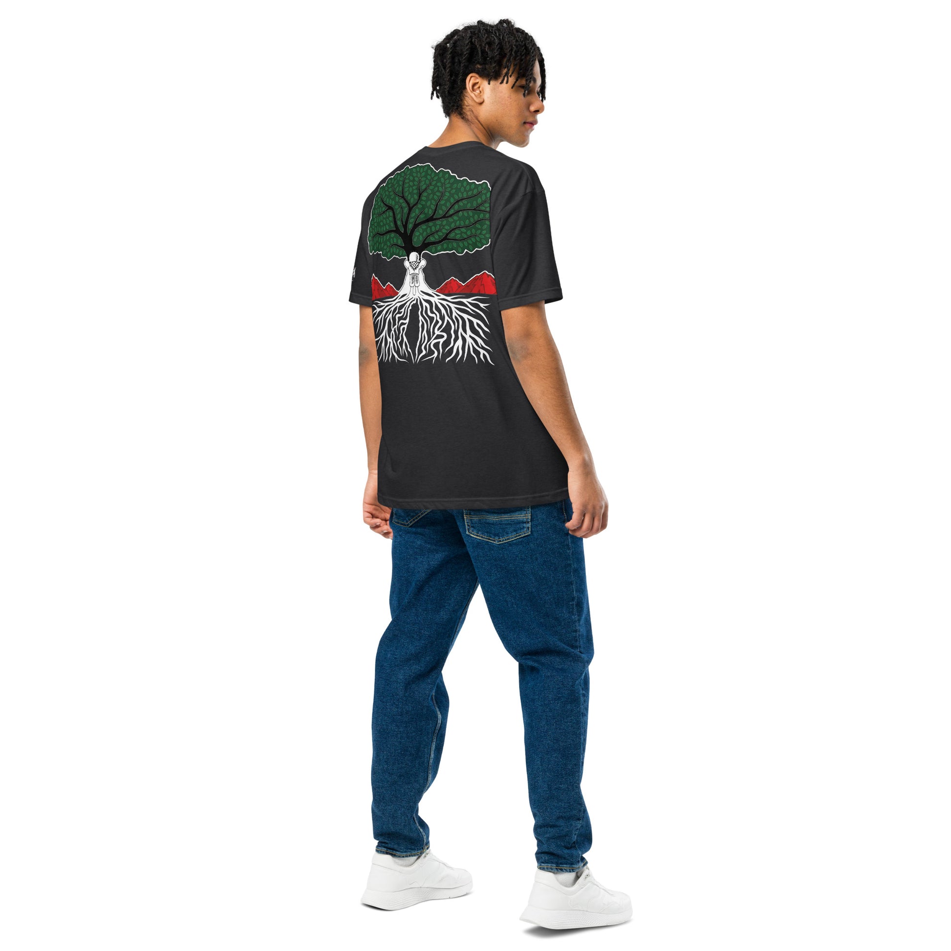 Model wearing EMBRACE YOUR ROOTS Palestine graphic tee from the Mo Hamz Collection