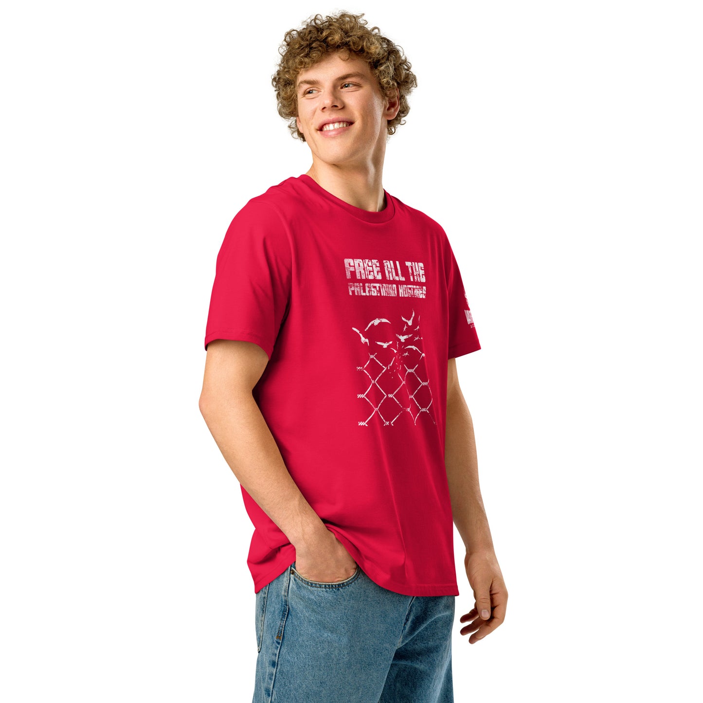 Male model wearing the Free all the palestinian hostages shirt with broken fence and birds graphic design