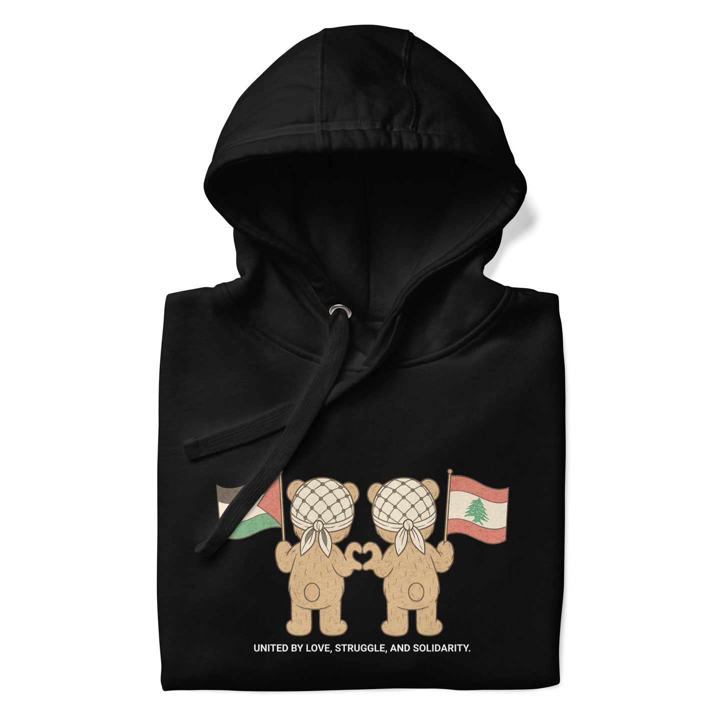 Black hoodie featuring two teddy bears wearing keffiyehs, holding Palestinian and Lebanese flags. Text below reads "United by Love, Struggle, and Solidarity."